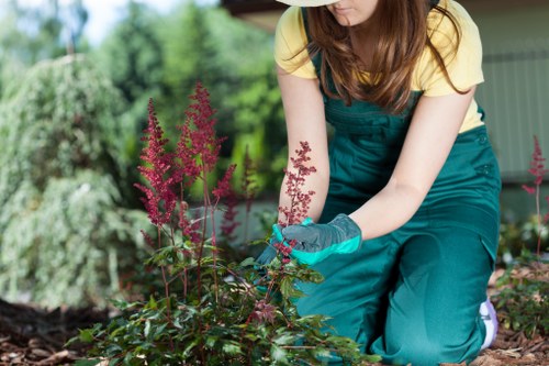 Landscape worker wearing PPE during outdoor maintenance